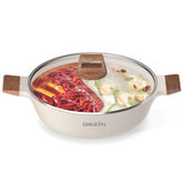 Olla Dezin Shabu Shabu con divisor para dos caldos, ideal para reuniones.
