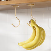 Colgador de bananas Josmimic con adhesivo dorado bajo mueble para espacio extra