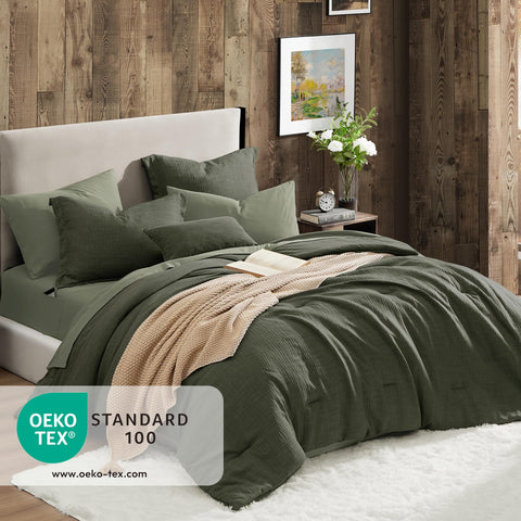 Geniospin Cobertor en tono verde oscuro, detalle de textura suave para confort diario.