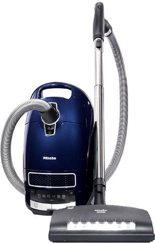Aspiradora Miele Complete C3 Marin con accesorios integrados para uso práctico.