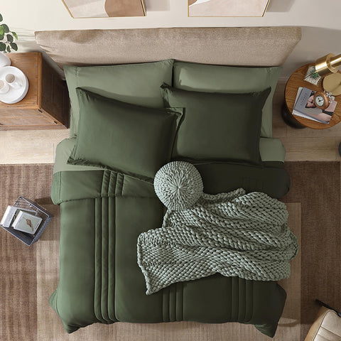 Sábana plana Monbix Reina oliva aporta suavidad y aspecto limpio.